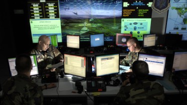 Capt. Jason Simmons and Staff Sgt. Clinton Tips update anti-virus software for Air Force units to assist in the prevention of cyberspace hackers July 12 at Barksdale Air Force Base, La. The Air Force is setting up the Air Force Cyberspace Command soon and these Airmen will be the operators on the ground floor. (U.S. Air Force photo/Tech. Sgt. Cecilio Ricardo)